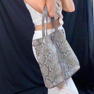 Hobo Style Snake Print purse, includes portable usb charger.